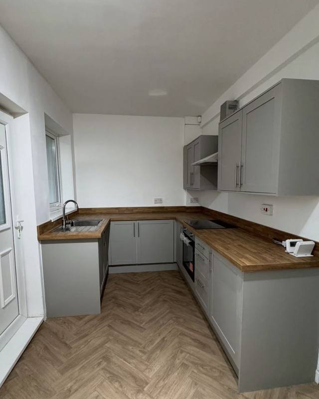 New grey kitchen with wooden worktops